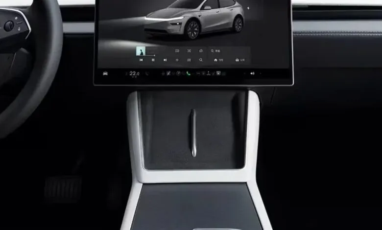 Tesla Model Y interior featuring center console and touchscreen display.