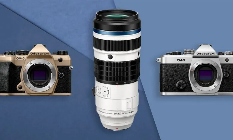 OM System OM-5 and OM-3 cameras with a 50-200mm lens on a blue background.