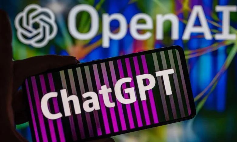 ChatGPT on phone screen with OpenAI logo in background.