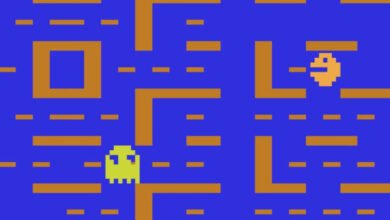 Atari Pac-Man game screen with Pac-Man and a ghost in a maze.