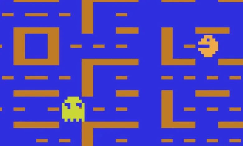 Atari Pac-Man game screen with Pac-Man and a ghost in a maze.