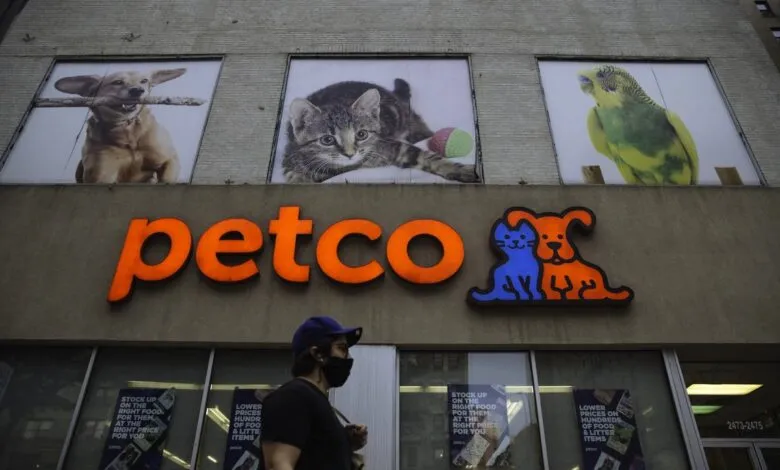 Petco store exterior with dog, cat, and bird images above the entrance.