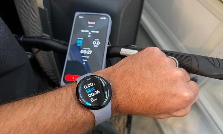 Pixel Watch displaying workout data on wrist with phone showing similar stats.