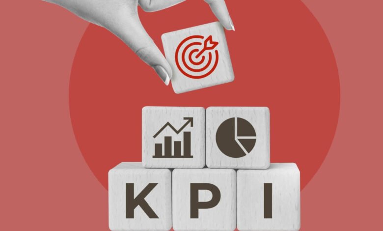 Wooden blocks spelling KPI with target icon being placed on top.