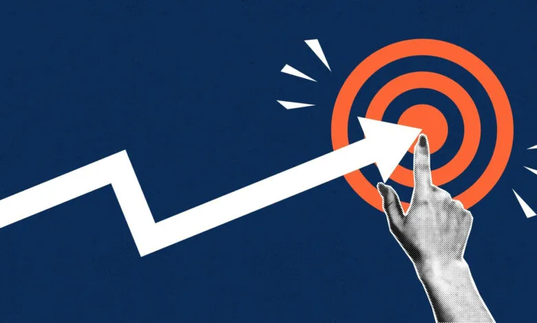 White arrow points to orange target, hand touches bullseye.