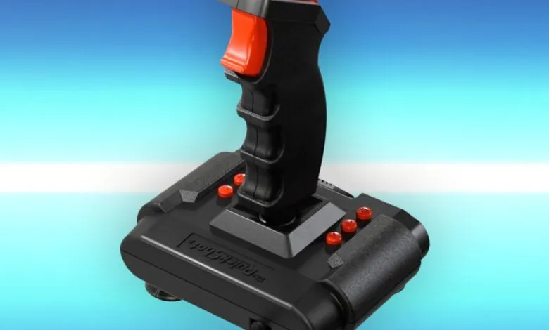 Close-up of a black Quickshot II joystick with red buttons.