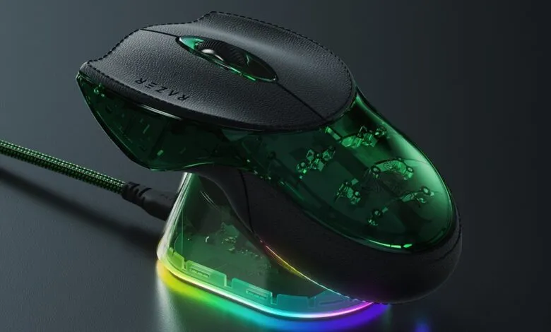 Razer Boomslang gaming mouse on charging dock with RGB lighting.