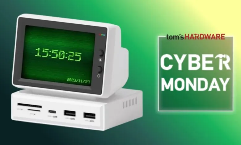 Retro computer with green screen displaying time and date, Cyber Monday ad.