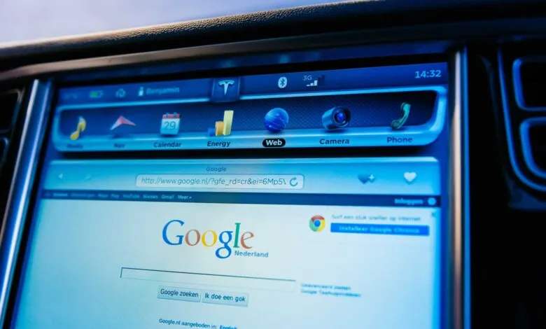 Tesla dashboard display showing Google search engine interface.