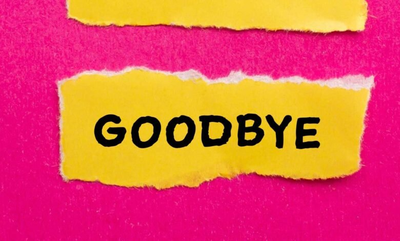 Torn yellow paper with 'Goodbye' in black on pink background.