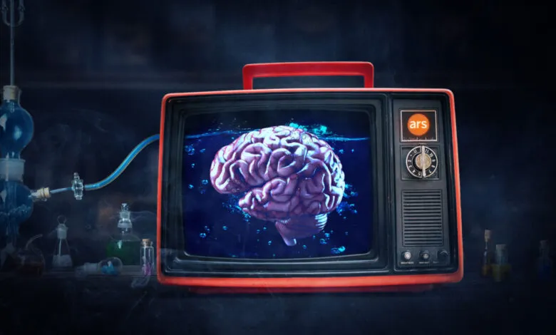 Retro TV displays brain in water, connected to lab equipment.
