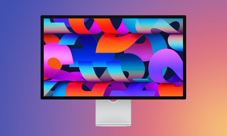 Studio Display with vibrant abstract wallpaper on a gradient background.