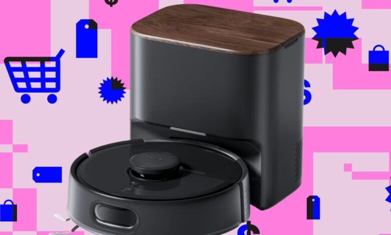 SwitchBot robot vacuum and dock on a pink and white patterned background.