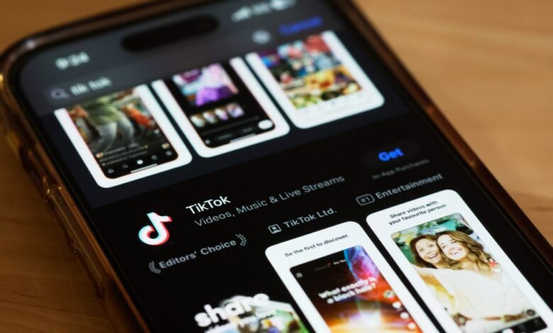 Close-up of a phone screen displaying the TikTok app in the app store.