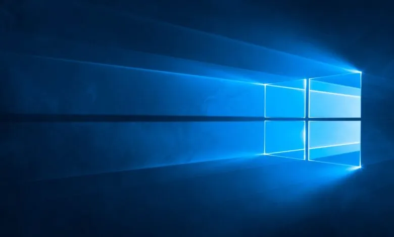 Windows logo in blue with light rays emanating from the center.