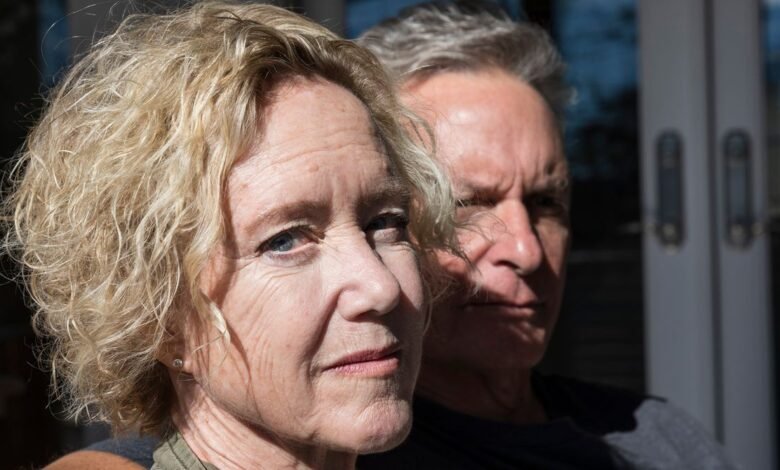 Portrait of a woman with blonde hair and a man with gray hair.