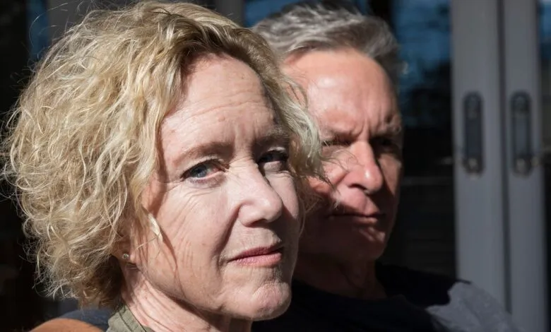 Portrait of a woman with blonde hair and a man with gray hair.