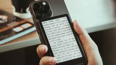 Smartphone with e-reader attachment displaying text from a book.