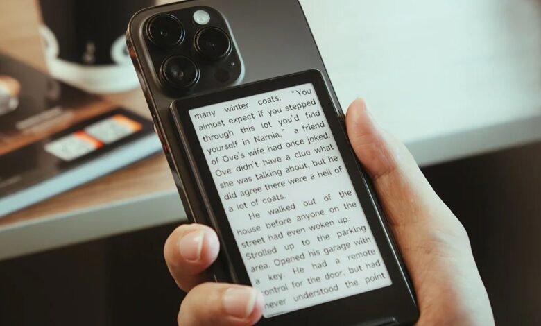 Smartphone with e-reader attachment displaying text from a book.