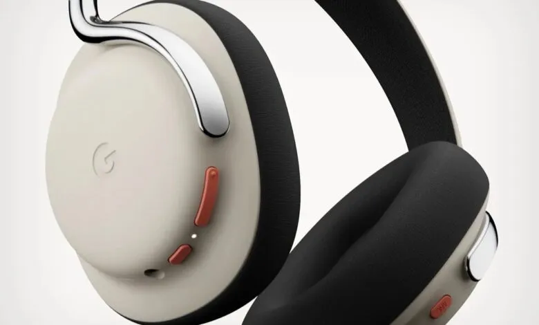 Close-up of stylish beige and black wireless headphones with silver accents.