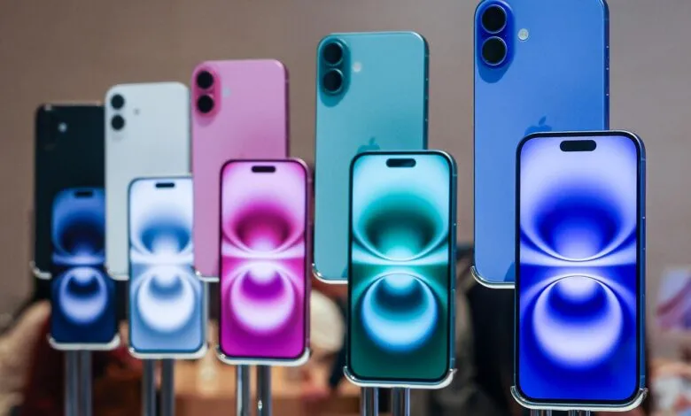 Display of colorful iPhones showing different models and colors.