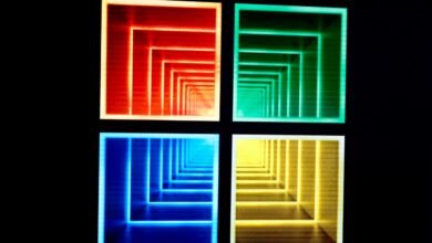 Four colorful squares with nested, receding square patterns on black background.