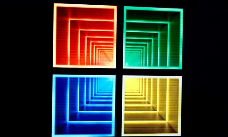 Four colorful squares with nested, receding square patterns on black background.