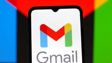 Gmail logo displayed on a smartphone screen with colorful background.