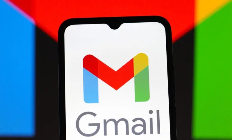 Gmail logo displayed on a smartphone screen with colorful background.