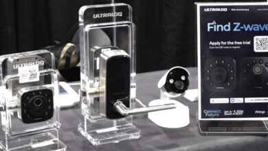 Ultraloq smart locks and security camera on display at a trade show.