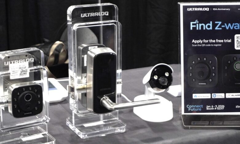 Ultraloq smart locks and security camera on display at a trade show.
