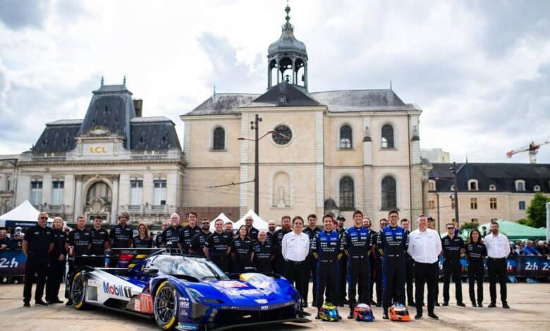 Cadillac Racing team and car pose at 24 Hours of Le Mans scrutineering.