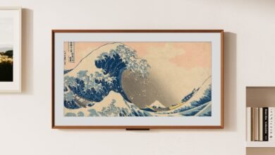 Framed print of 'The Great Wave off Kanagawa' hangs on a white wall.