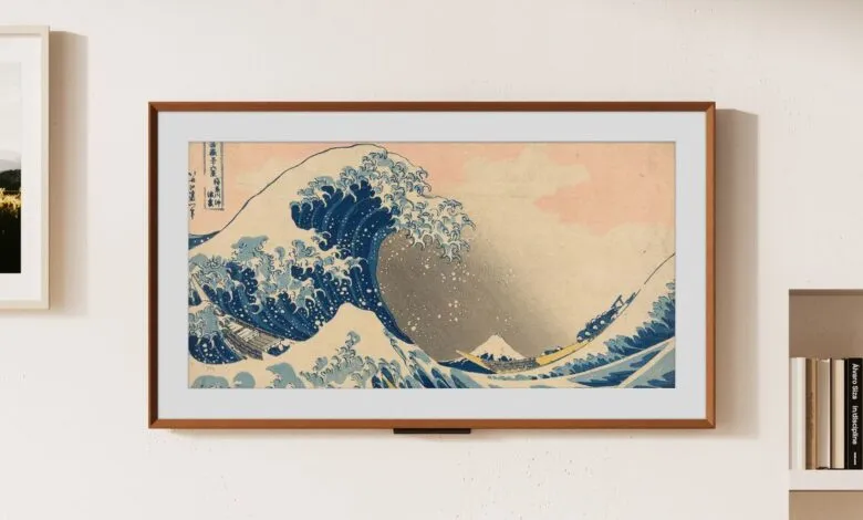 Framed print of 'The Great Wave off Kanagawa' hangs on a white wall.