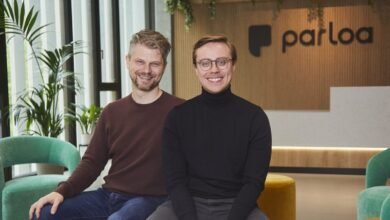 Two smiling men, Stefan Ostwald and Malte Kosub, founders of Parloa, pose indoors.