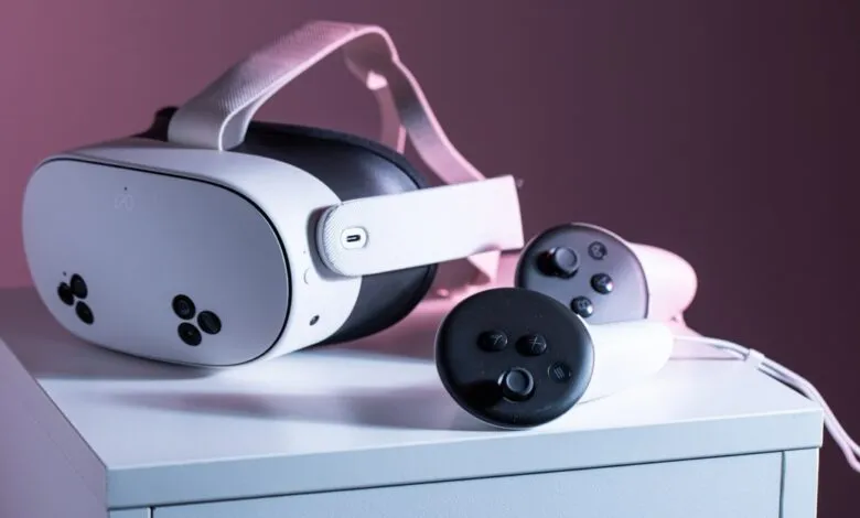 Meta Quest 3S VR headset and controllers on a white surface.