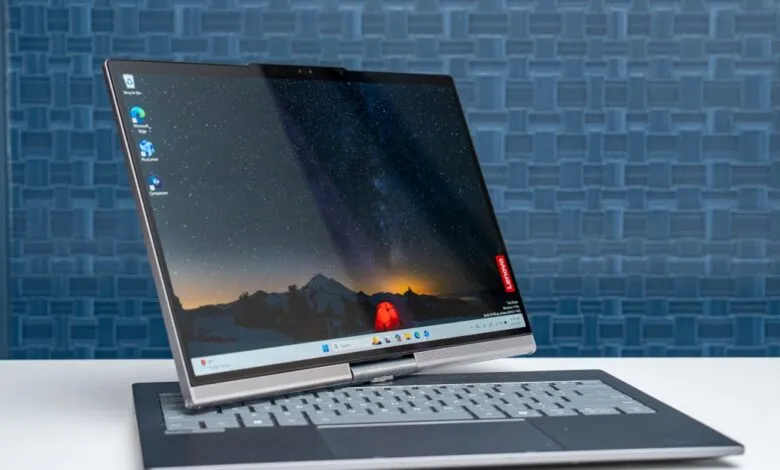 Lenovo ThinkBook Plus Gen 7 laptop with rotating screen on white table.