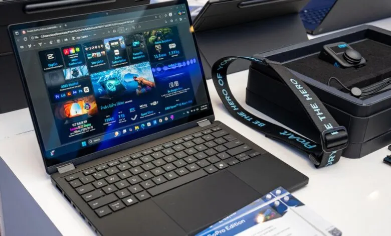 Asus ProArt GoPro Edition laptop on display with GoPro accessories.