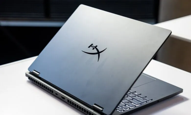 HyperX Omen 15 gaming laptop with logo on the lid, partially open.