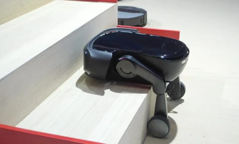 Roborock robot vacuum climbing stairs with wheeled legs.