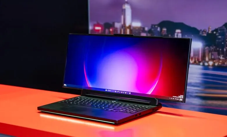 Lenovo Legion Pro rollable gaming laptop concept on orange surface.
