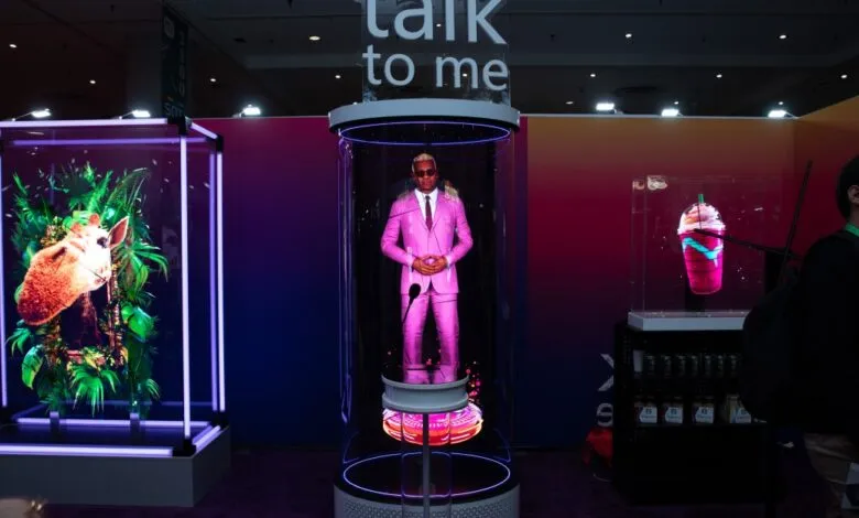 Retail expo booth featuring holographic displays of a man, animal, and drink.