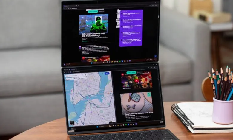 Asus Zenbook Duo laptop with dual screens displaying web content.