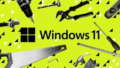 Windows 11 logo surrounded by various hand tools on a patterned background.