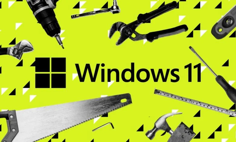 Windows 11 logo surrounded by various hand tools on a patterned background.