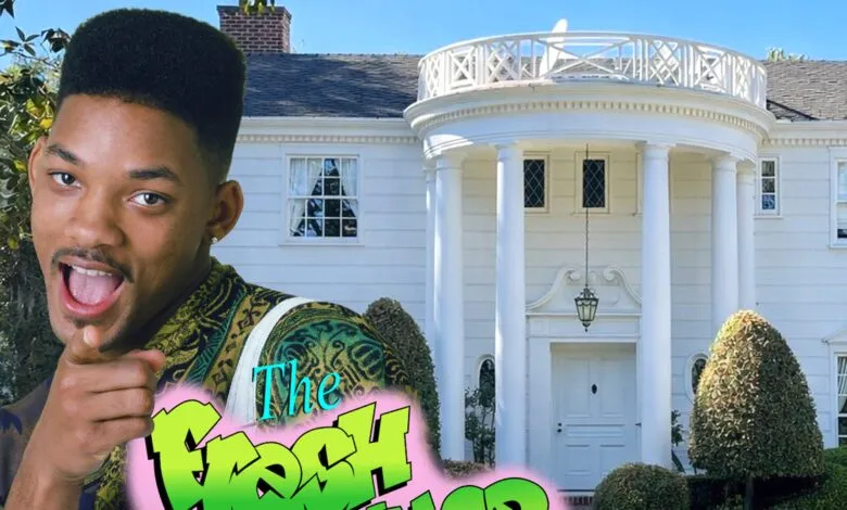 Will Smith in front of Fresh Prince mansion, pointing at viewer.