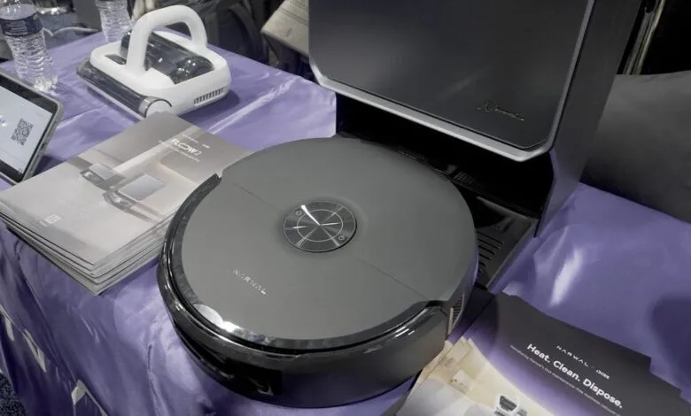 Narwal cleaning products on display, including robot vacuum and handheld cleaner.