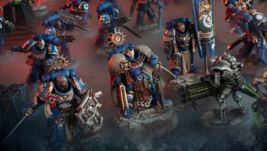 Warhammer 40k Ultramarines miniatures in blue armor, ready for battle.