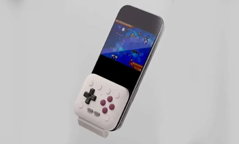 Smartphone with retro-style gamepad attachment for mobile gaming.