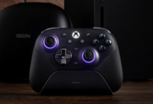 8BitDo Ultimate Controller on charging dock with Xbox console and case.